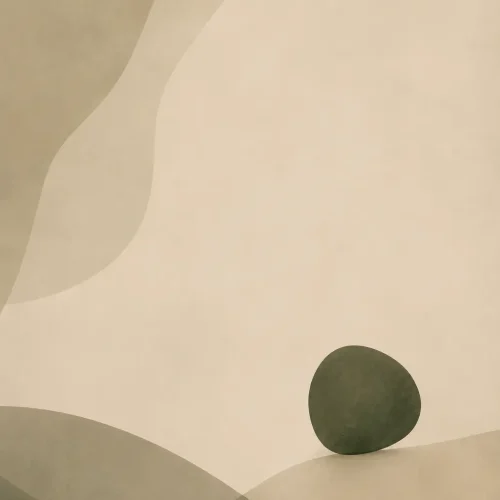 One small deep green form held within a spacious neutral background